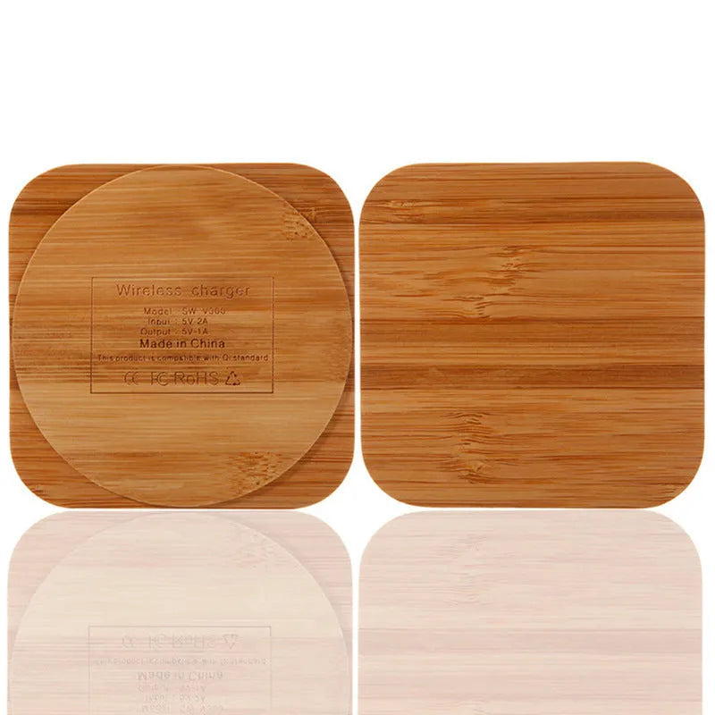 Square wooden bamboo 5W Qi wireless charging pad for smartphones on a table.