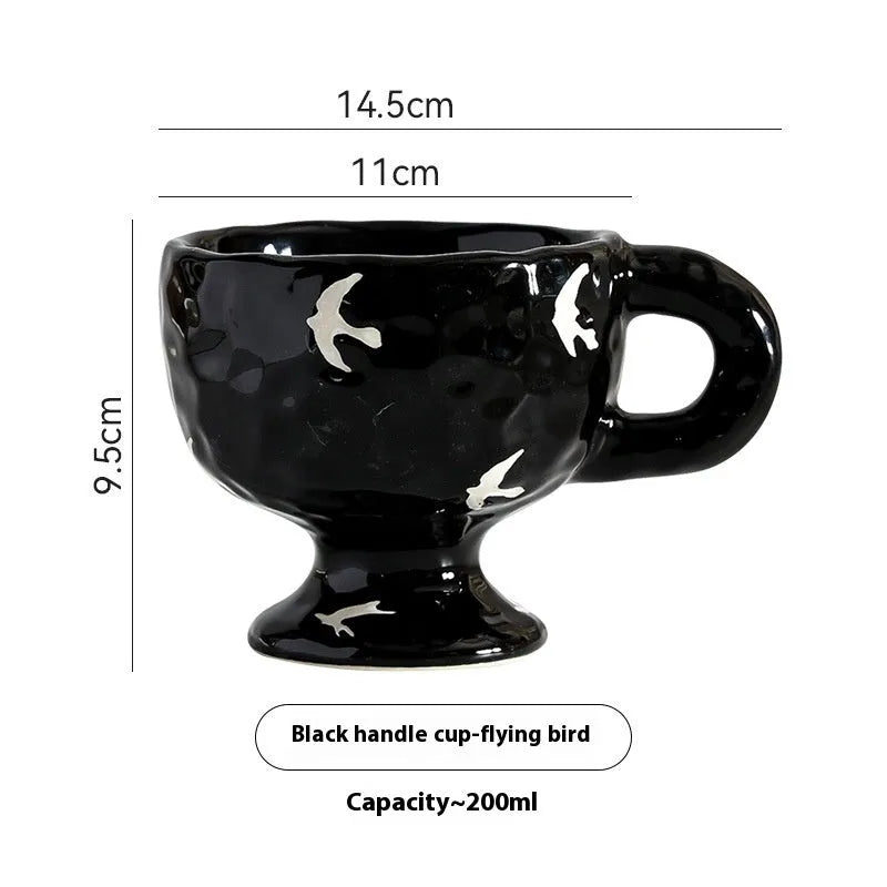 Hand-pinched irregular ceramic mug in solid colour with modern design