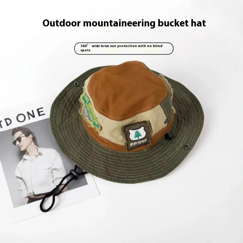 Army green cotton foldable fisherman hat with flat top crown and hand-painted punk details