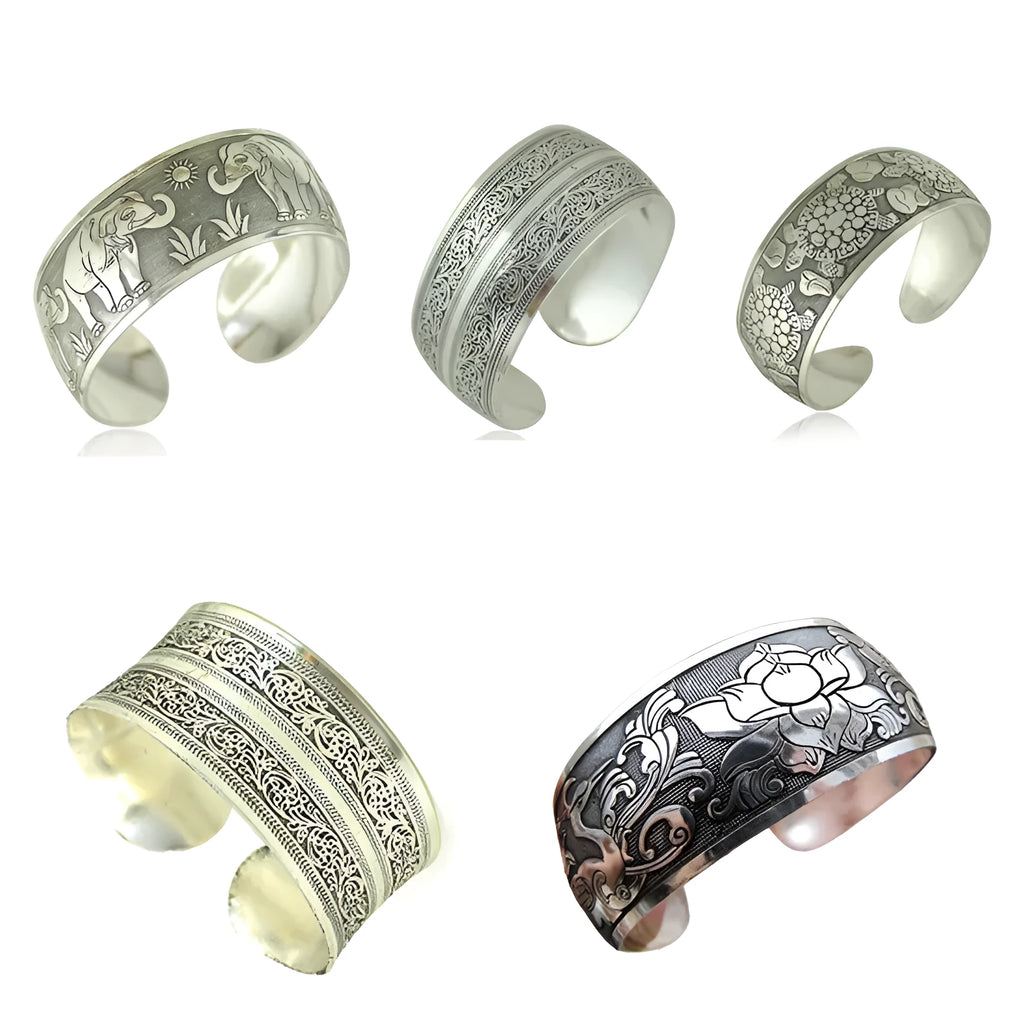 Open carved Miao silver alloy bracelet with elephant and turtle motifs on a Roman-shaped band.