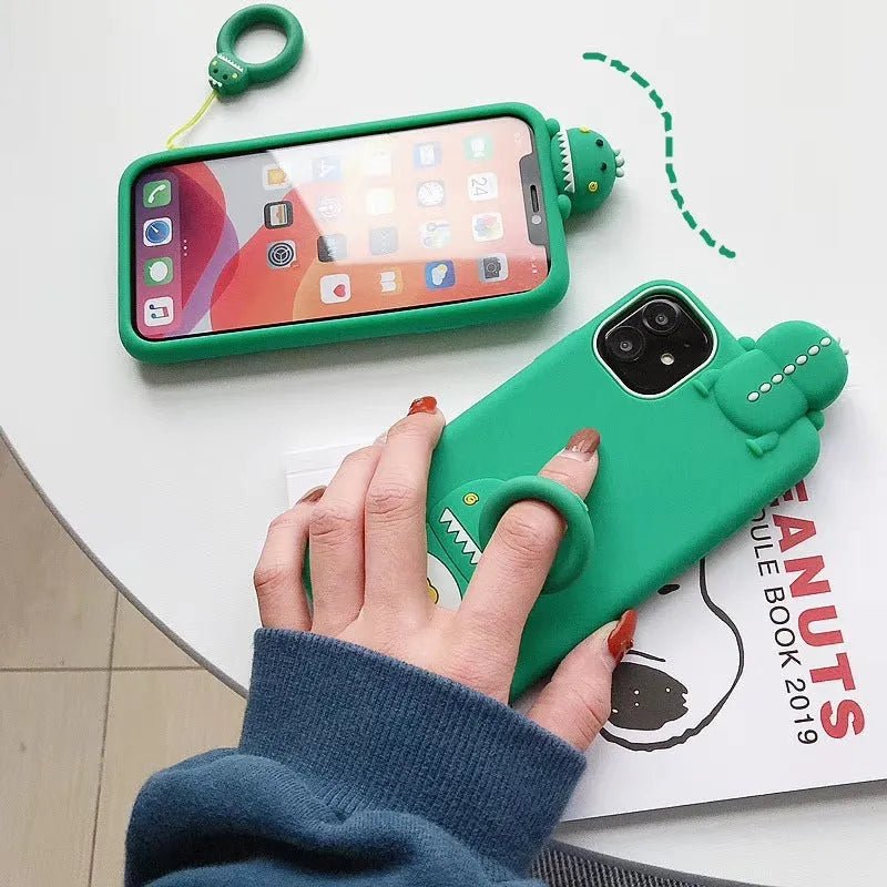 Green silicone iPhone case with cartoon animal design showing waterproof and drop protection features