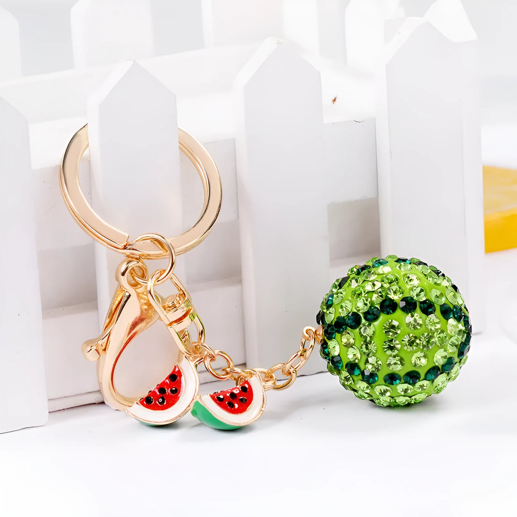 Green zinc alloy watermelon keychain measuring 12 cm in length.