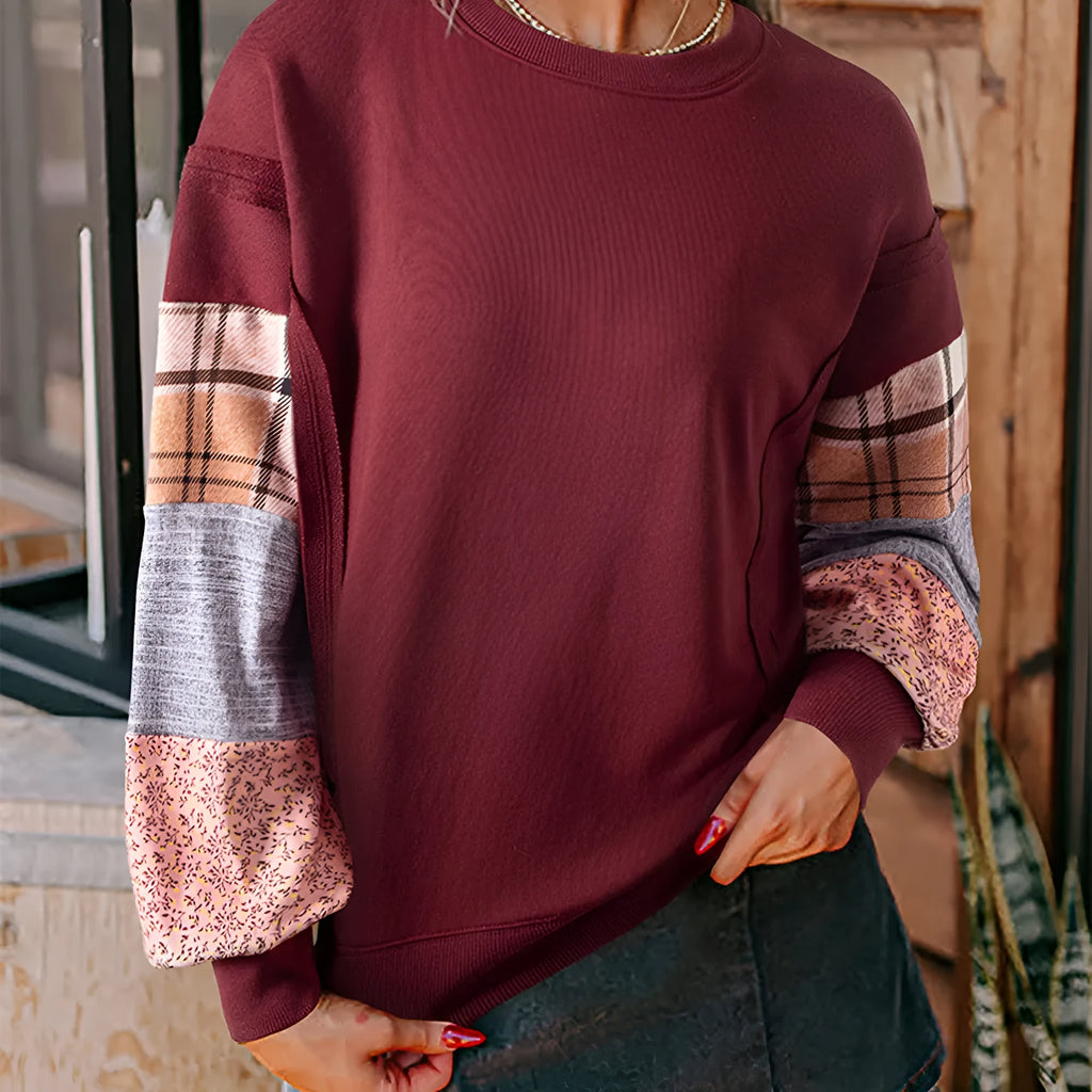 Women's loose plaid long-sleeved casual top in apricot colour on a hanger.
