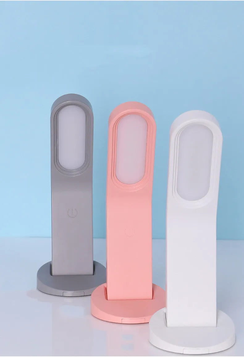 Simple white LED desk lamp with touch control and USB cable on a modern desk