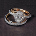 Genuine 925 sterling silver and 14K rose gold ring set with oval white sapphire and diamond accent on finger