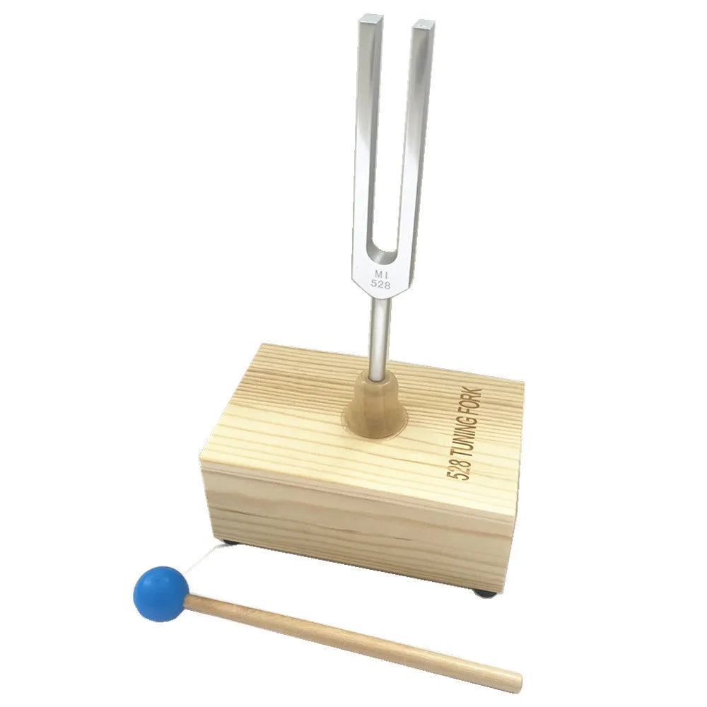Aluminium alloy 432Hz tuning fork with acoustic speaker on kraft paper background