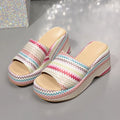 Women's beige wedge sandals with a blue and pink wave print design, thick rubber sole, and fish mouth toe.