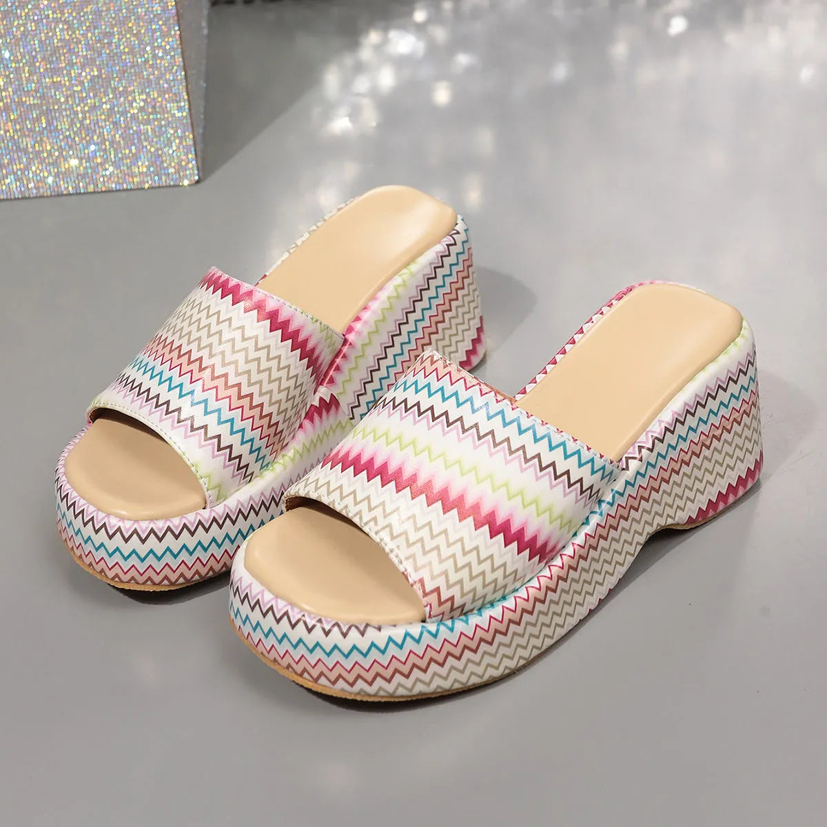 Women's beige wedge sandals with a blue and pink wave print design, thick rubber sole, and fish mouth toe.