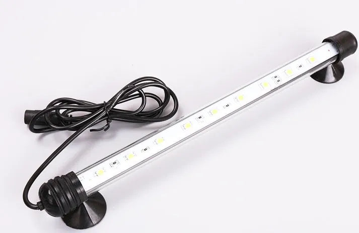 LED aquarium submersible lamp with blue light underwater in fish tank showing fish and rocks