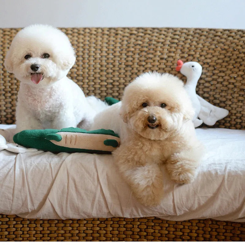 Green plush dog toy measuring 35cm long and 18cm wide for interactive pet play