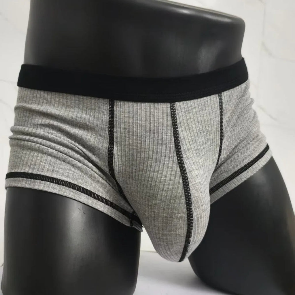 Men's solid colour breathable fibre boxer shorts shown in army green, demonstrating thin fabric and fit.
