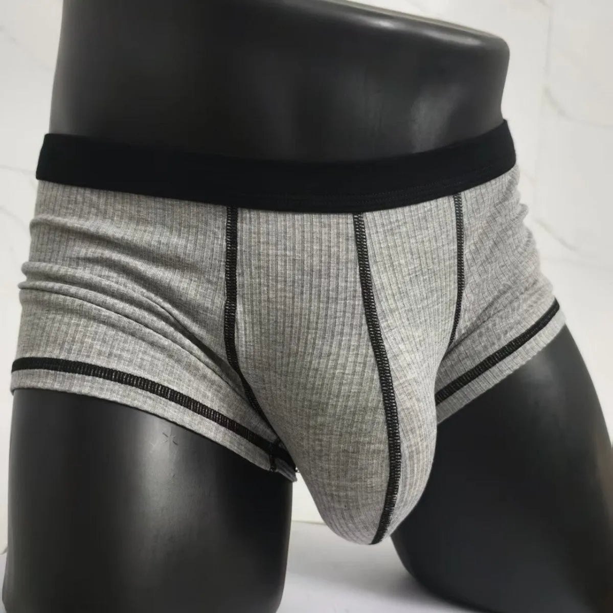 Men's solid colour breathable fibre boxer shorts shown in army green, demonstrating thin fabric and fit.