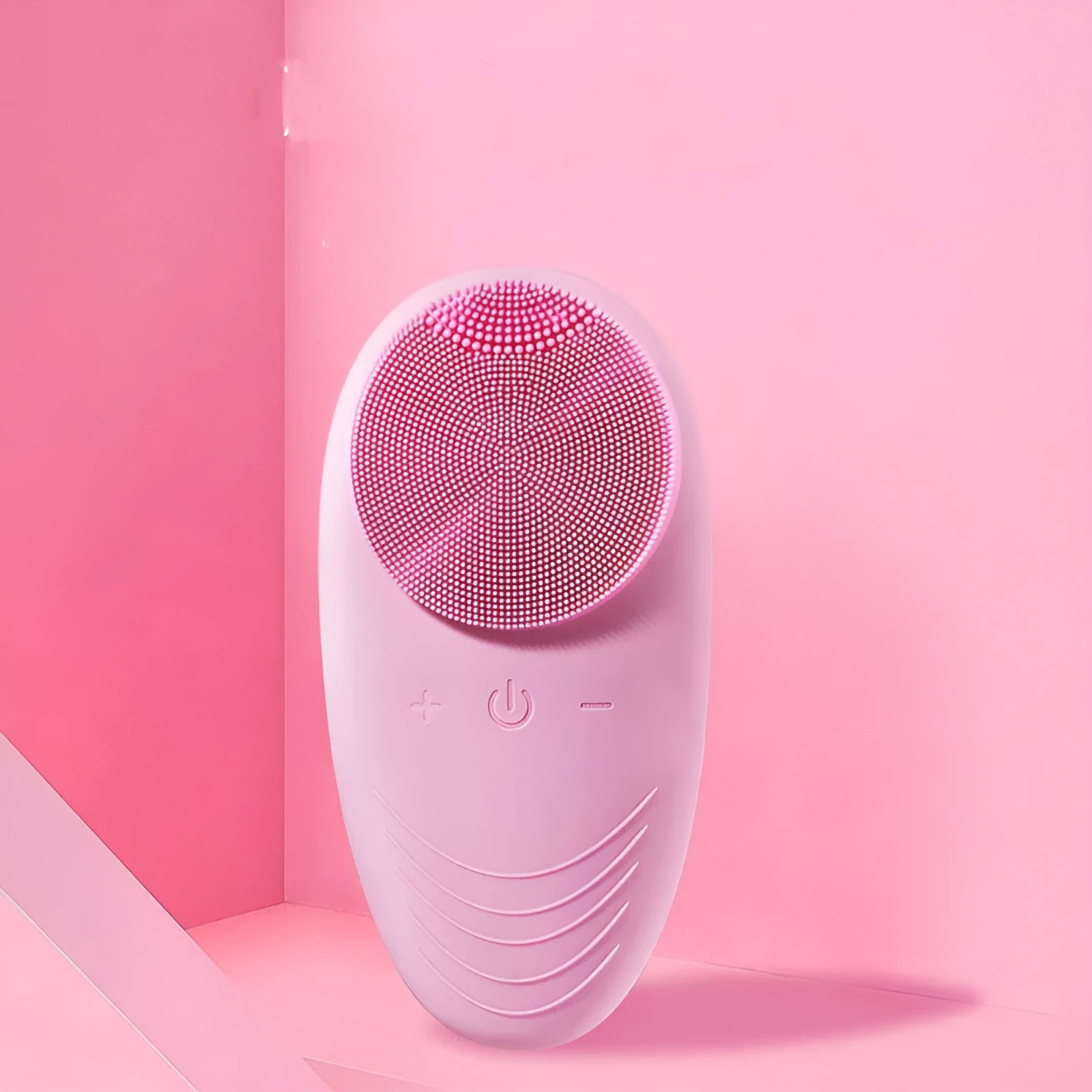 Mini electric facial cleansing brush with silicone head in pink, USB cable, compact 12x6x2.5cm