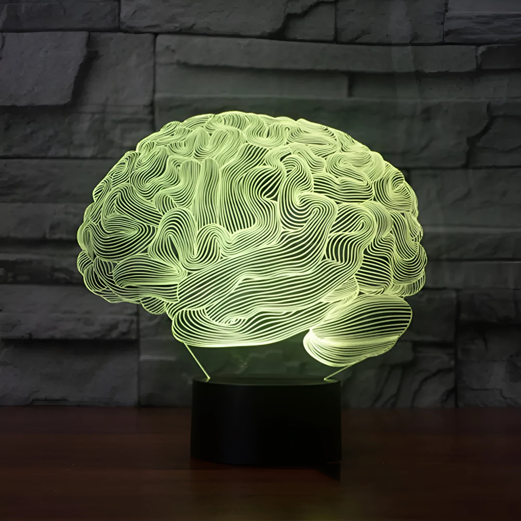 3D acrylic LED desk lamp showing colourful light projection with remote control on a wooden table.
