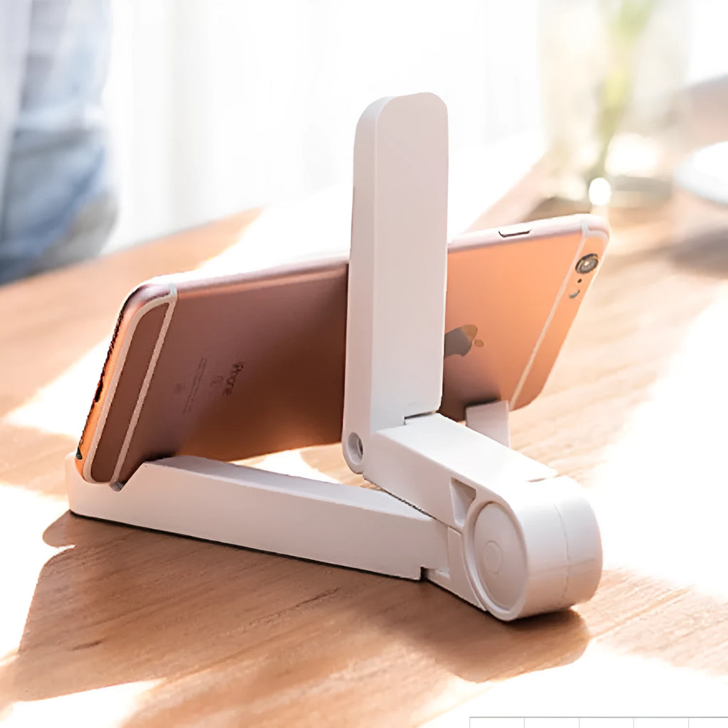 Foldable tablet holder shown in black with smartphone mounted in landscape orientation