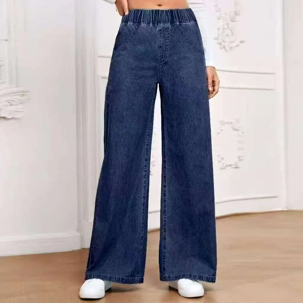 Plus size light blue wash wide leg jeans with straight fit and zip fly