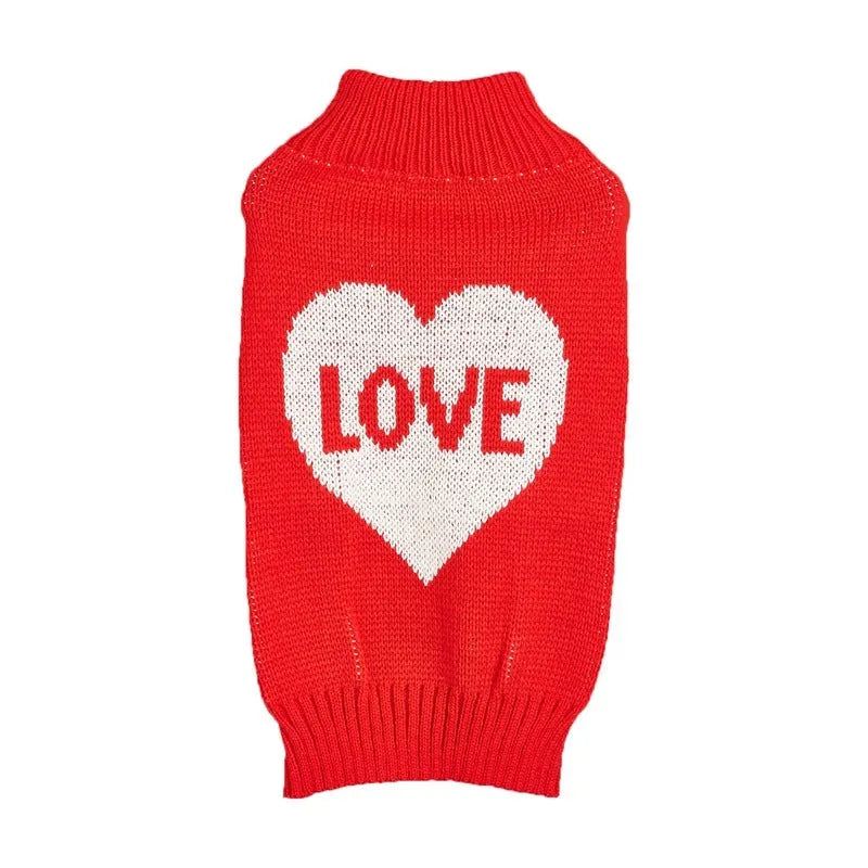 Red dog sweater with a white love heart and bow design on a small dog.
