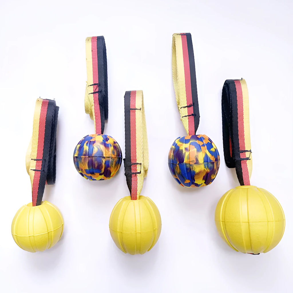 Floating camouflage and yellow EVA string ball dog toy shown in 6.5cm, 7cm and 9cm diameter sizes