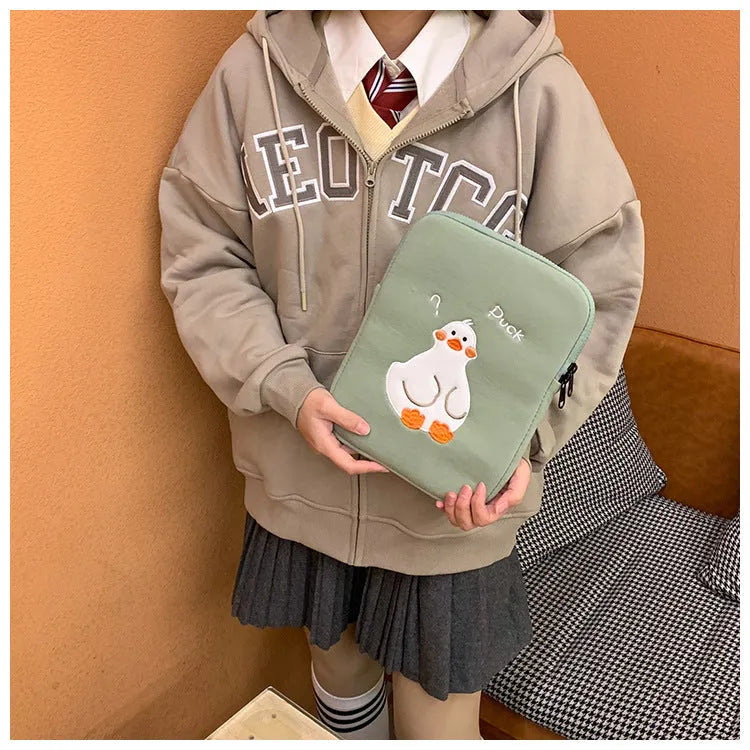 Blue tablet case with embroidered cartoon duck design and zipper closure