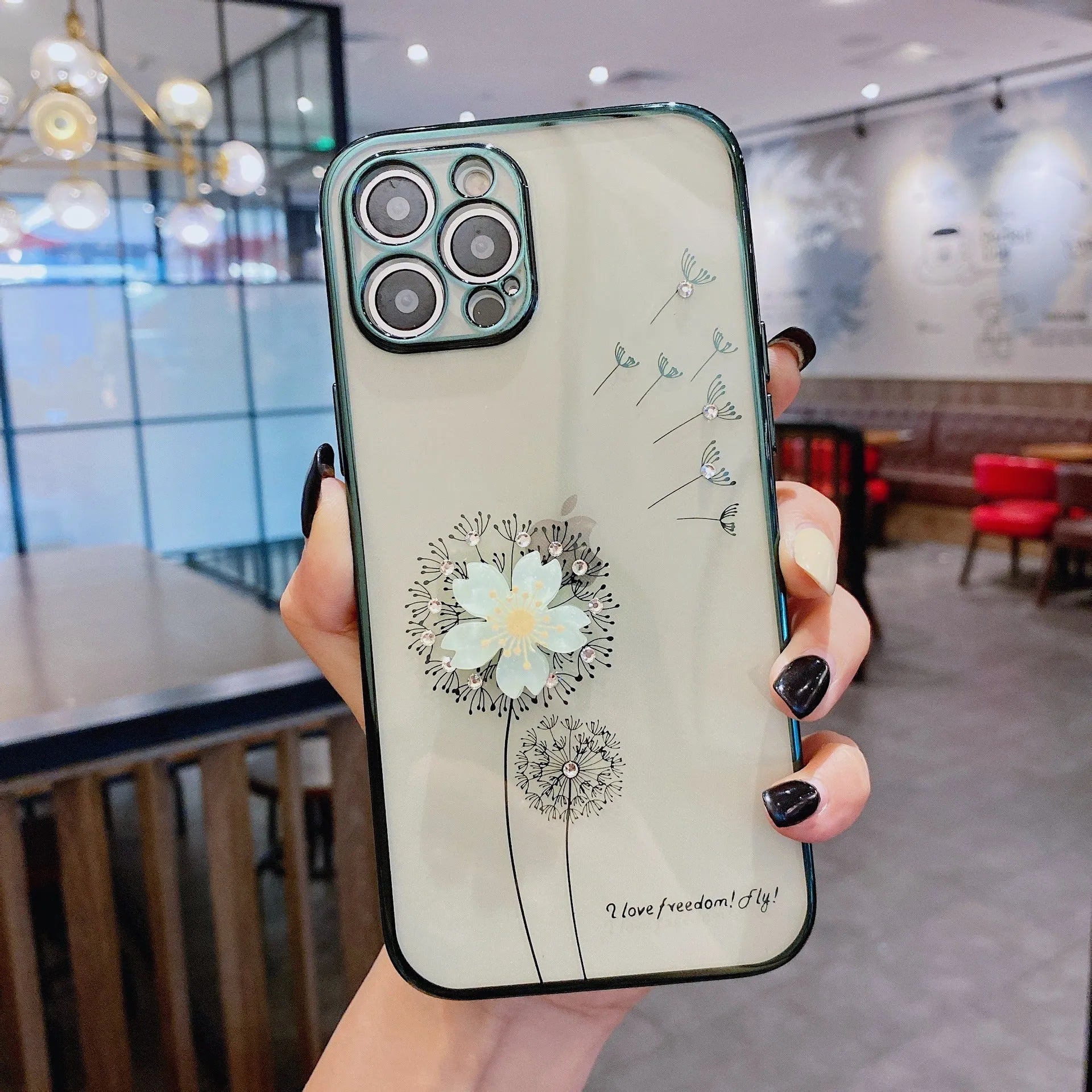 Green 3D floral patterned iPhone case with a silver rotating ring stand on the back.