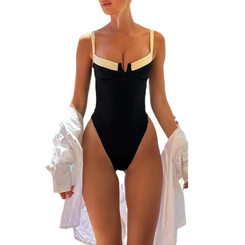 Women's contrast colour one-piece swimsuit in black and red, polyester outer with nylon lining, briefs-style cut for swimming and wading.