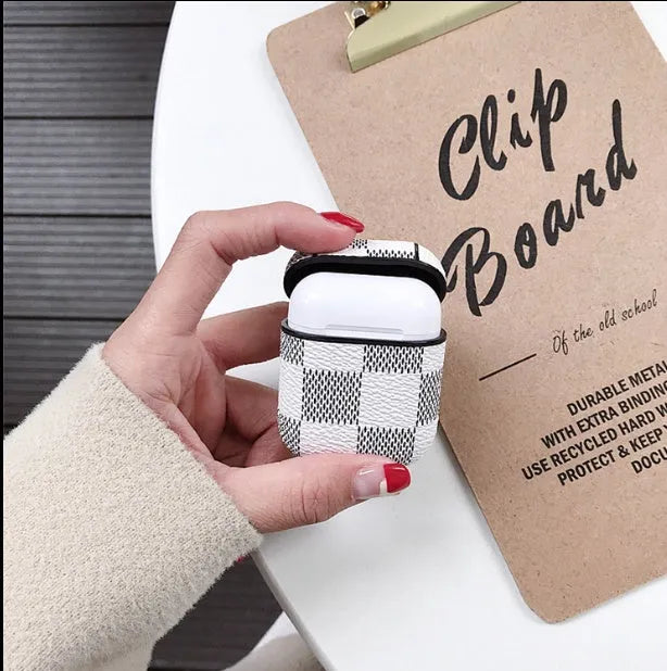 iPhone XS Max hard shell plastic case with grid pattern and integrated hook for Apple AirPods 2nd gen case.