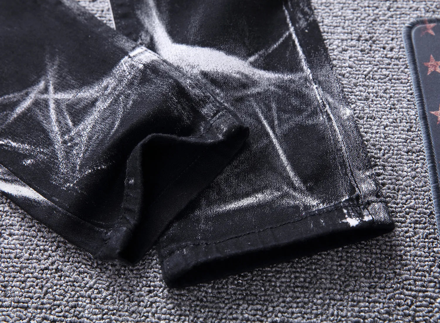 Men's black wolf print jeans with realistic wolf head design on cotton denim fabric
