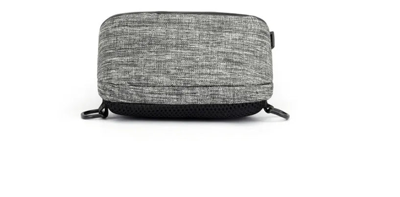 Small dark blue Oxford cloth chest bag with zipper closure showing internal phone compartment