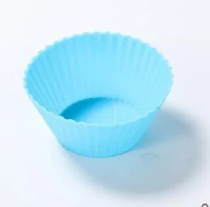 12 nonstick reusable silicone cupcake liners in six colours arranged for baking