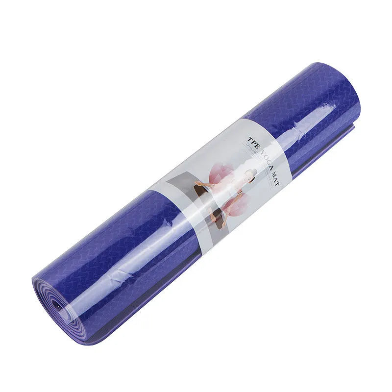 Pure colour EVA yoga brick, thick non-slip mat, and cotton tension band on a floor, in blue, purple, pink, red, black, gray