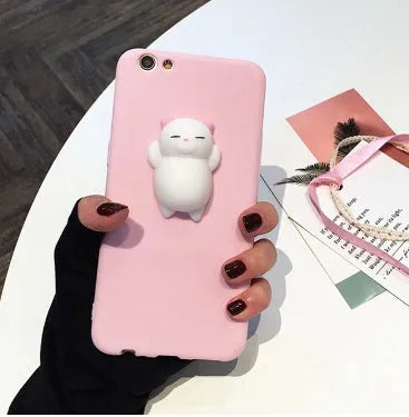 Soft silicone iPhone case with a raised 3D cartoon cat design in pink.