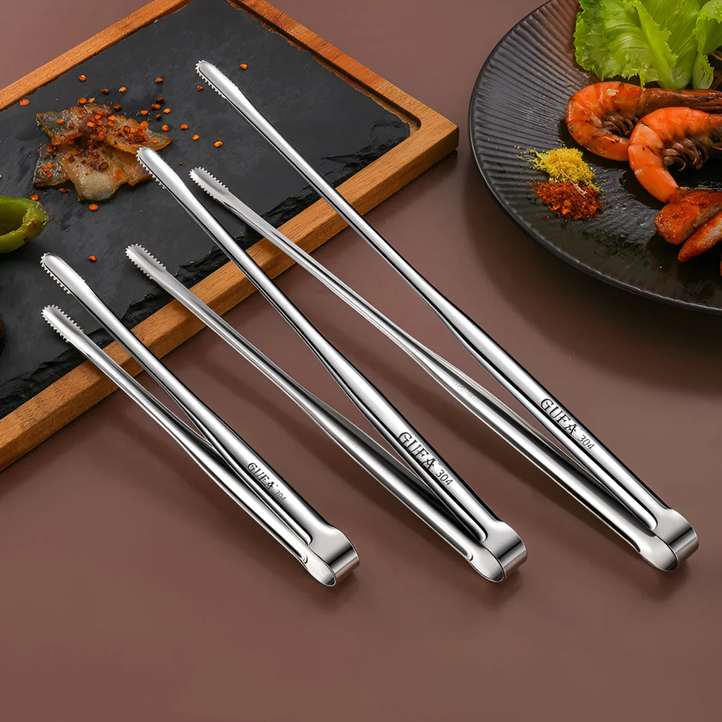 Stainless steel barbecue clamp in modern simple design on a table, showing the three size options small medium large