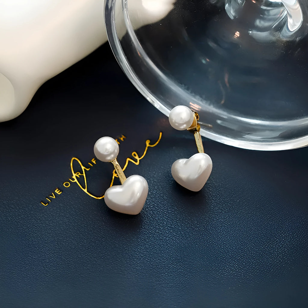 A pair of Korean-style heart-shaped stud earrings with inlaid artificial gems on an alloy base.