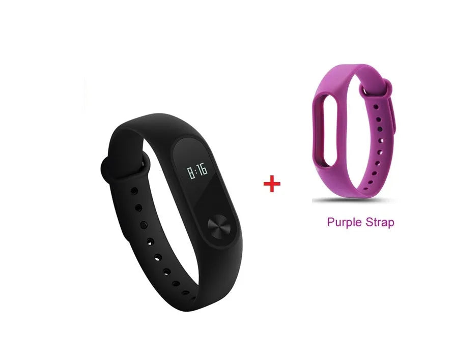 Black Xiaomi Mi Band 2 fitness tracker on wrist showing OLED display with heart rate reading
