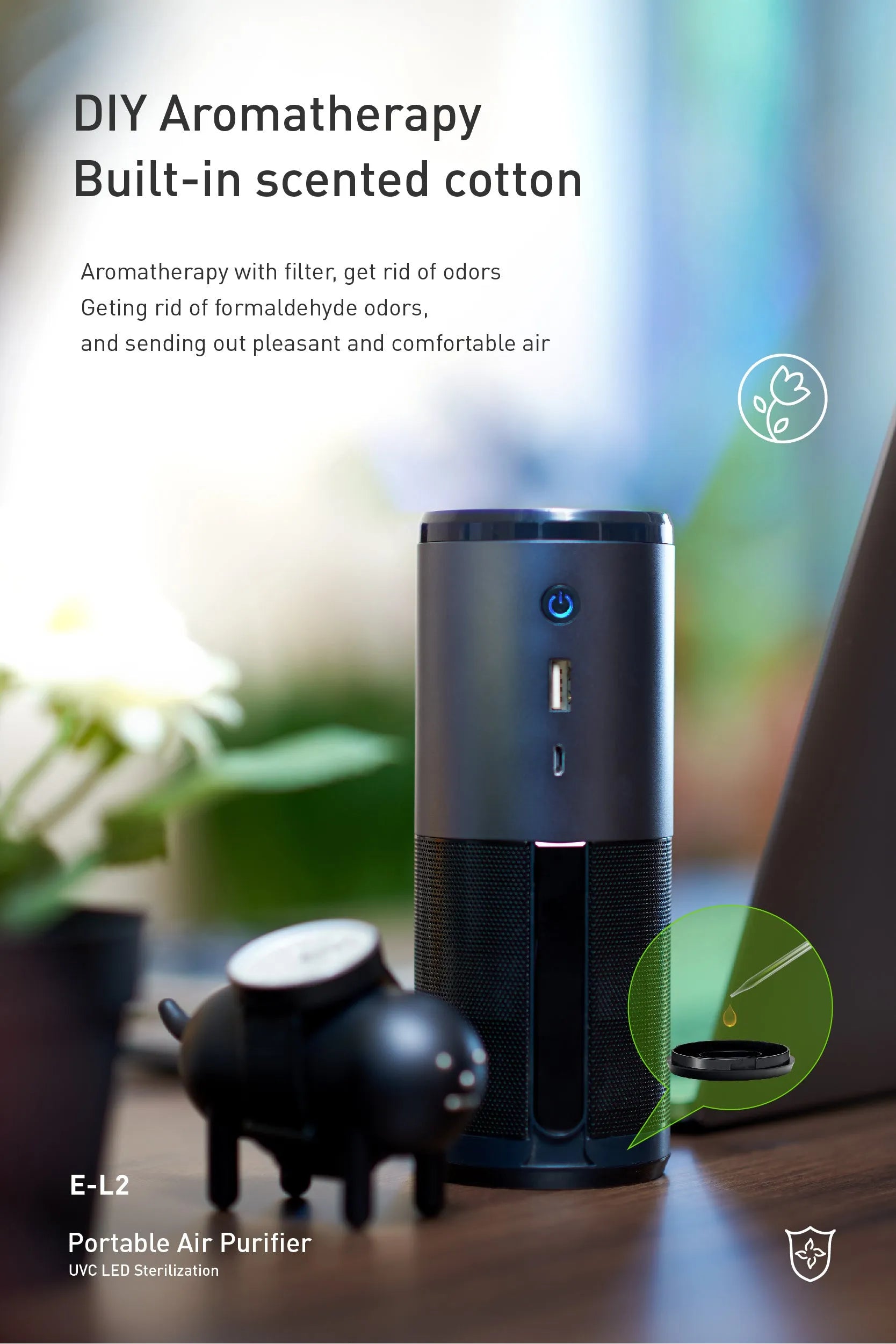Black portable mini car air purifier with USB cable on a car dashboard