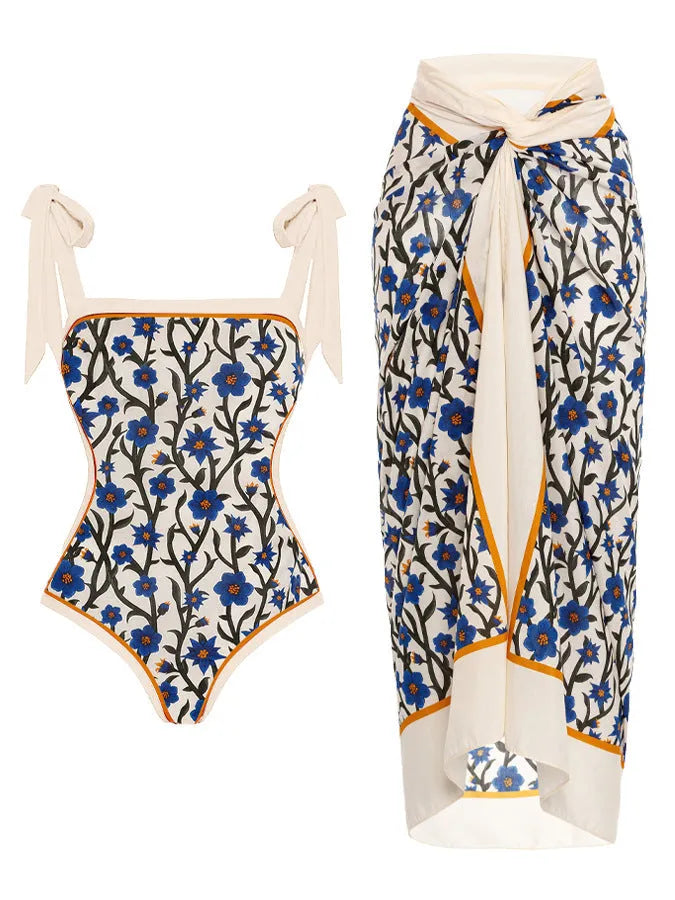 Women's floral print two-piece swimsuit with a sheer chiffon hip skirt, shown in one of the available colour variations.