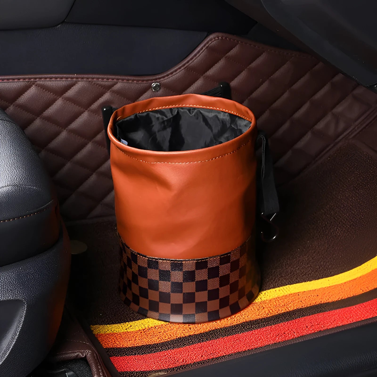 Tan retractable leather car trash can with handle in expanded position