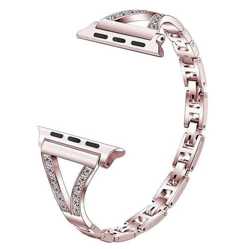 Stainless steel Apple Watch strap with diamond studs in rose gold, shown attached to a watch.