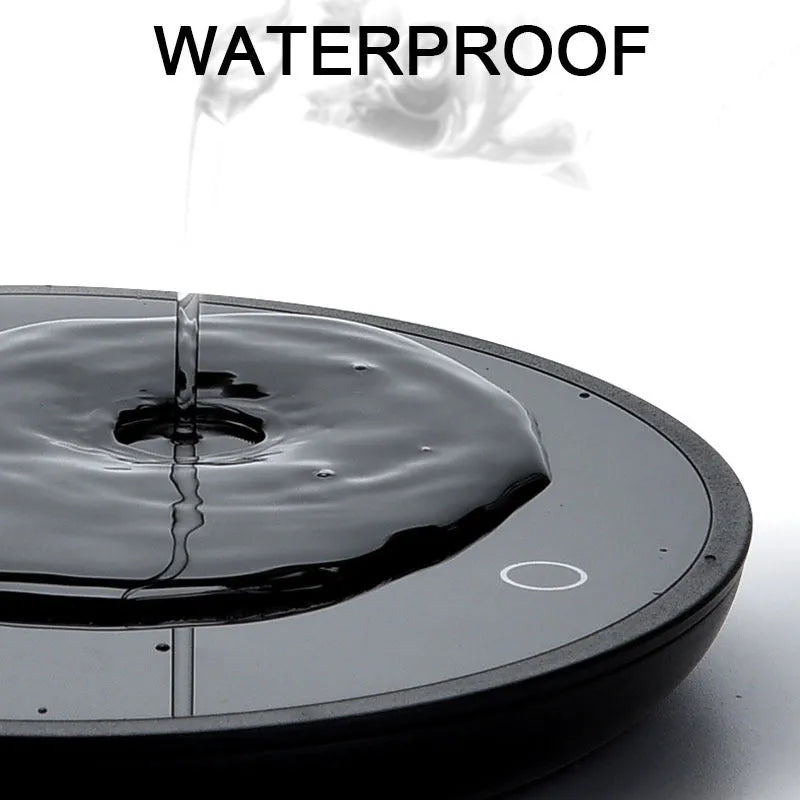 Black adjustable temperature cup warmer with tempered glass surface and low/high switch