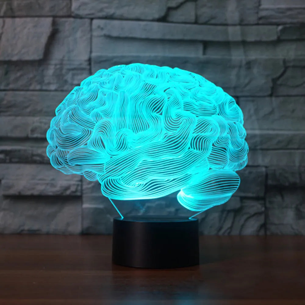 3D acrylic LED desk lamp showing colourful light projection with remote control on a wooden table.