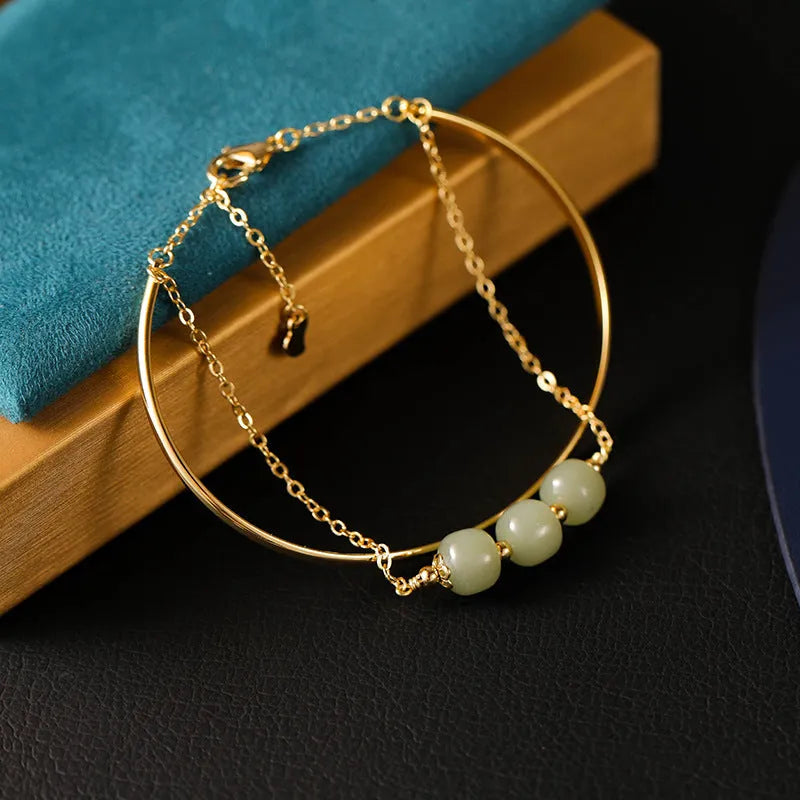 Women's Hetian jade lucky beads bracelet with gold inlay, shown in single, double, and three bead versions.