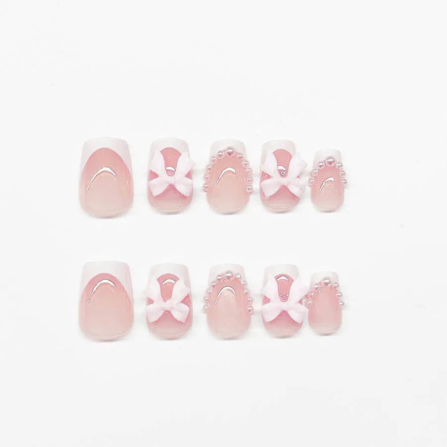 Short French manicure nail art set with tulip patterns and bow designs