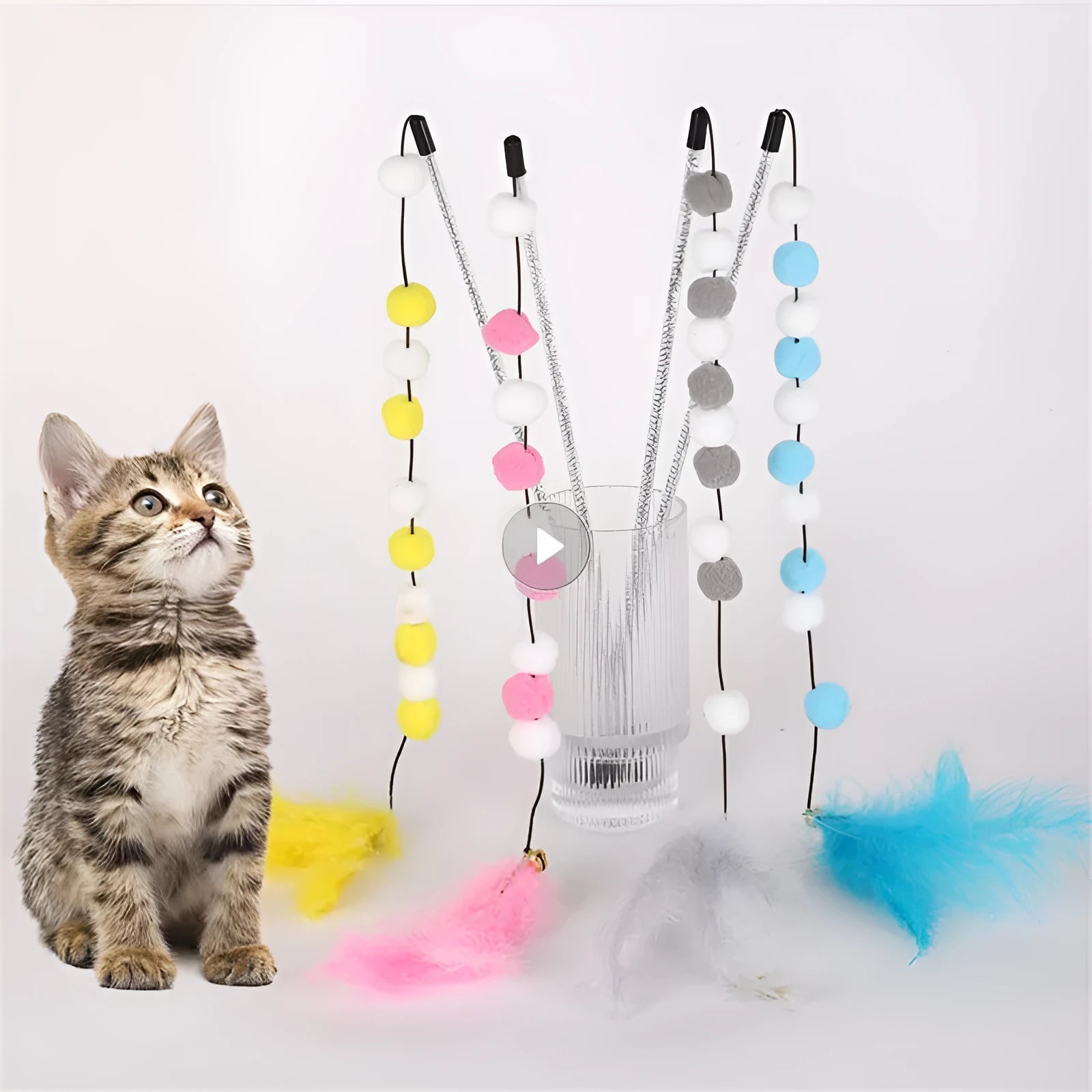 Blue cat teaser stick toy with a bell and a grey pompon feather, shown at approximate 31cm length.