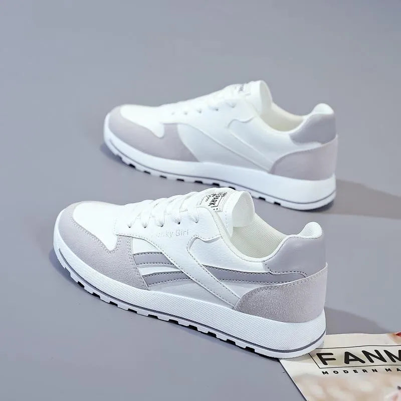 Women's lightweight running sports shoes in white and gray with lace-up front and PU outsole