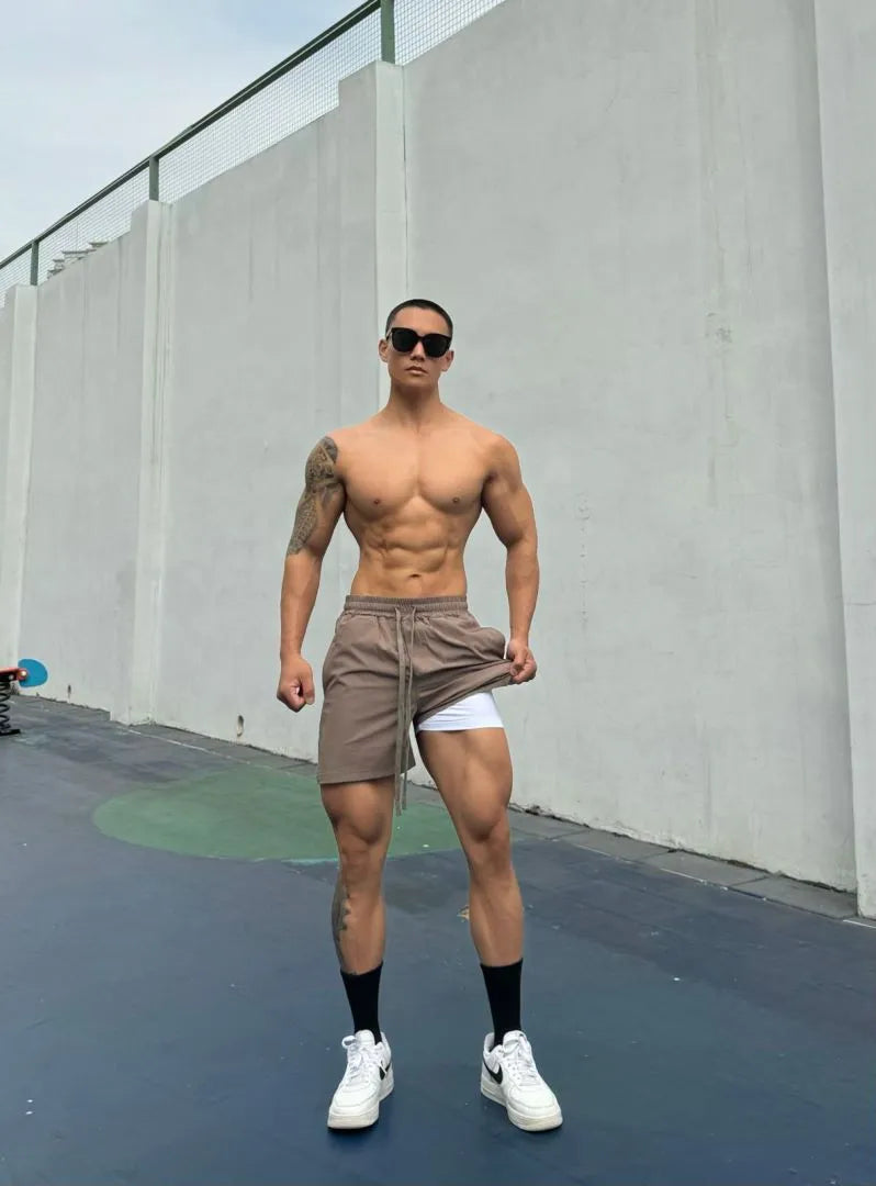 Men's black quick-drying nylon ice silk shorts with double-layer quarter-length design