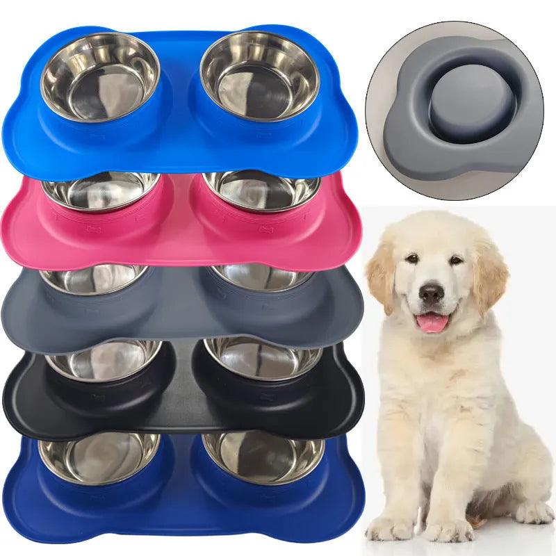 Large silicone double dog bowl in blue with two compartments for food and water on a kitchen floor.