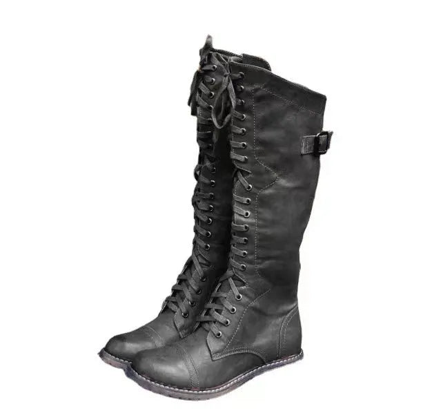 Women's black casual high leg boots with a chunky low heel and round toe on a plain background