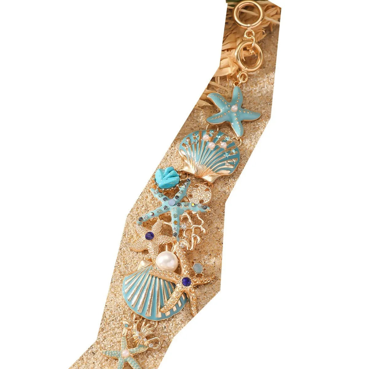 Alloy rhinestone marine bracelet with boat anchor and shell details in blue coral colour