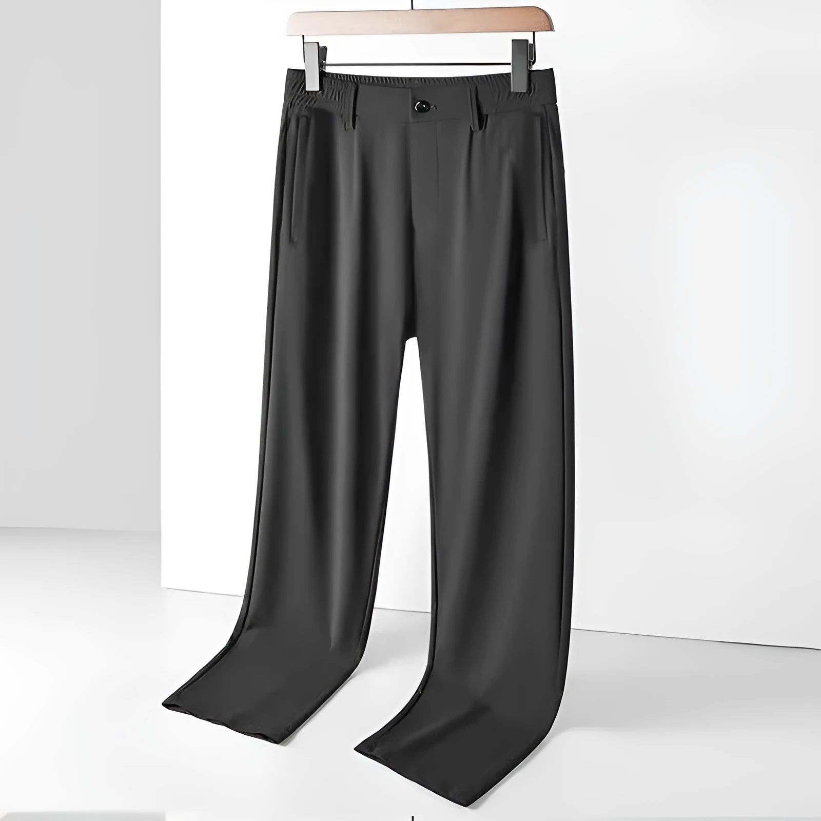 Man wearing black loose-fit ice silk straight leg casual trousers.