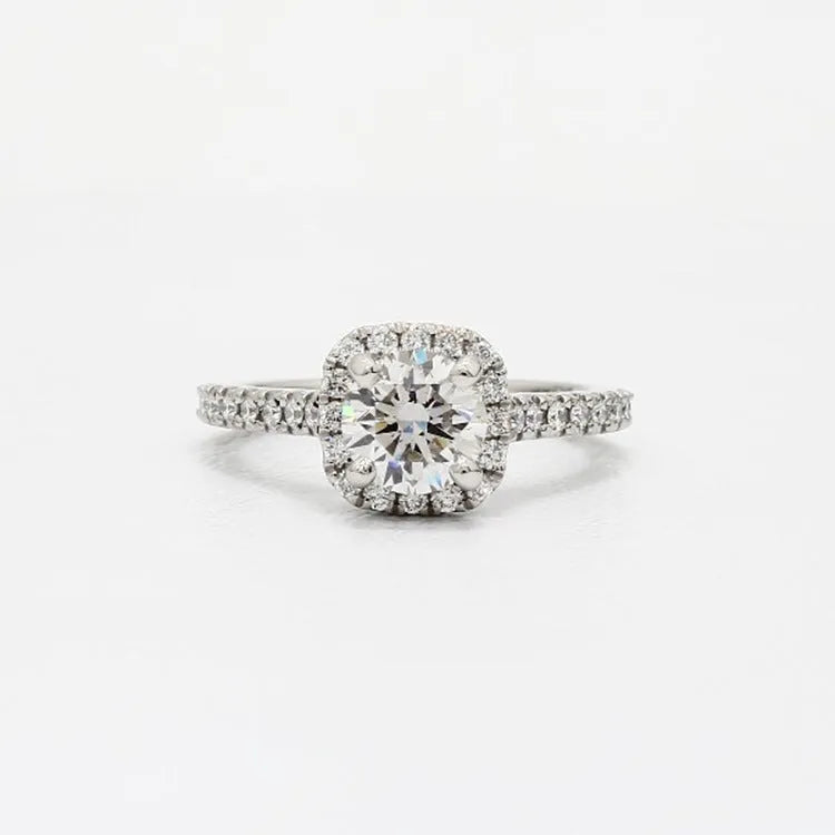 Geometric sculpted platinum alloy ring with diamond insert on white background